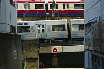 Japan, Tokyo, Shinagawa, Dai Ichi Keihin street buildings, two trains near JR Shinagawa station.