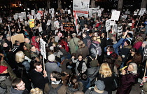 England, London, Anti-War protesters against the bombing of Syria outside the House of Commons carrying Dont Bomb Syria placards.