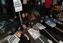 England, London, Anti-War protesters against the bombing of Syria outside the House of Commons carrying Dont Bomb Syria placards.