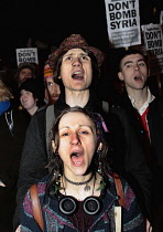 England, London, Anti-War protesters against the bombing of Syria outside the House of Commons carrying Dont Bomb Syria placards.