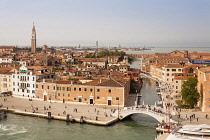 Italy, Venice, Panoramic view of buildings, rooftops, promenade and bridge over Rio dell Arsenale, at the Arsenale.
