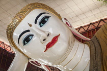 Myanmar, Yangon, Face of reclining Buddha, Chaukhtatgyi Pagoda.