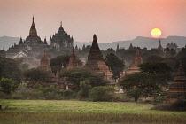Myanmar, Bagan, Ananda Temple on left and Thatbyinnyu Temple adjacent to Ananda Temple, at sunset.