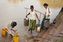 Myanmar, Bagan, Villagers collecting water from a lake, Minnanthu.