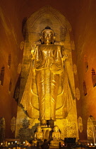 Myanmar, Bagan, Large golden Gautama Buddha inside Ananda Temple.