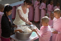 Myanmar, Mandalay, Nuns queuing for a meal, Sakyadhita Thilashin Nunnery School, Sagaing.