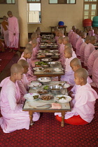 Myanmar, Mandalay, Nuns eating their meals, Sakyadhita Thilashin Nunnery School, Sagaing.
