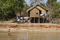 Myanmar, Shan State, A house beside a tributary to Inle Lake, near Indein and Nyaung Ohak villages.