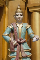 Myanmar, Yangon, A religious statue at Shwedagon Pagoda.