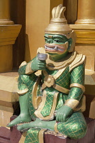 Myanmar, Yangon, Mythological demon statue at Shwedagon Pagoda.