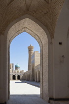 Uzbekistan, Bukhara, Kalon Mosque courtyard, also known as Kalyan Mosque, Kalon Minaret and Mir-i Arab Madrasah behind.
