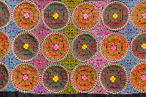 Uzbekistan, Bukhara, Colourful Suzani textile, cotton hand embroidered needlework for sale.