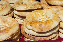 Uzbekistan, Samarkand, Non bread for sale, Siyob Market, also known as Siab Market.