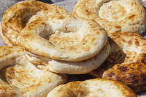 Uzbekistan, Samarkand, Non bread for sale, Siyob Market, also known as Siab Market.