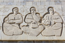 Uzbekistan, Samarkand, Carved stone figures on front of Afrosiab Museum, also known as Afrosiyob Museum.