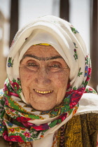 Uzbekistan, Shakrisabz, An elderly Uzbek woman with gold teeth.
