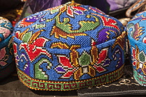Uzbekistan, Shakrisabz, Colourful hat for sale.