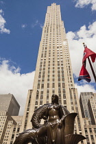 USA, New York City, Manhattan, GE Building and The Maiden, one of the Mankind Figures, Rockefeller Center.