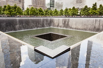 USA, New York City, Manhattan, One of the two waterfalls at National September 11 Memorial, World Trade Center.