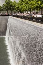 USA, New York City, Manhattan, One of the two waterfalls at National September 11 Memorial, World Trade Center.