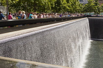 USA, New York City, Manhattan, One of the two waterfalls at National September 11 Memorial, World Trade Center.