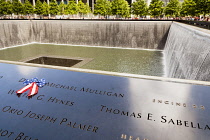 USA, New York City, Manhattan, One of the two waterfalls at National September 11 Memorial, World Trade Center.