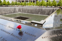 USA, New York City, Manhattan, One of the two waterfalls at National September 11 Memorial, World Trade Center.