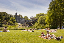 USA, New York City, Manhattan, Belvedere Castle, and people sunbathing, Central Park.