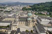 Austria, Salzburg, General view of the city and river Salzach from the Festung Hohensalzburg Fortress above the city with hills in the background.