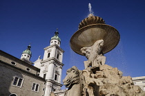 Austria, Salzburg, Salzburg Cathedral with the Residenzbrunnen or Residenz Fountain.