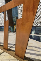 Ireland, Belfast, Titanic Quarter, Titanic Belfast Visitor Experience, Section of the building viewed through one of the letters.