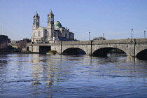 Ireland, County Westmeath, Athlone, Church of Saints Peter and Paul with the River Shannon.