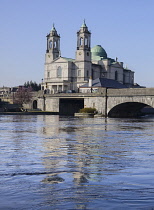 Ireland, County Westmeath, Athlone, Church of Saints Peter and Paul with the River Shannon.