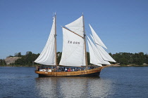 Helsinki, Finland, Ketch 'Astrid' with Helsinki Zoo in the background.