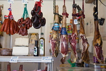 Spain, Andalucia, Cadiz, Display of jamon, chorizo & cheese at a carniceria in the Central Market.