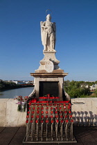 Spain, Andalucia, Cordoba, Statue of San Rafael patron saint of Cordoba on the Roman Bridge.