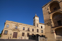 Spain, Andalucia, Cordoba, The Obispado de Cordoba Bishop's Palace on Calle Torrijos with a corner of the Mezquita in the right foreground.