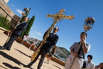 Spain, Andalucia, Granada, Crucifix carried at the head of the Corpus Christi procession from the Iglesia Santa Maria de la Alhambra.