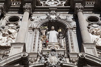 Spain, Andalucia, Granada, Statue of San Juan on the facade of  Iglesia de San Juan de Dios.