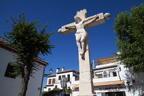 Spain, Andalucia, Granada, Stone crucifix in Plaza San Miguel Bajo in the Albayzin district.