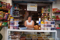 Spain, Andalucia, Granada, Shopkeeper in the Plaza de San Agustin.