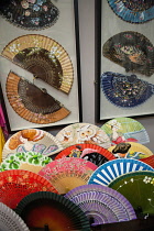 Spain, Andalucia, Granada, Display of fans in a boutique shop on Calle Zacatin.