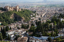 Spain, Andalucia, Granada, Panorama of the Alhambra and Albayzin district with Granada city in the background from the viewpoint at Iglesia de San Miguel.