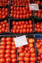 Spain, Andalucia, Seville, Display of tomatos at the Mercado de la Feria Feria Market.