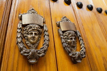 Spain, Andalucia, Seville, Knockers to a door of a house in the Triana district.
