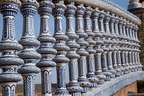 Spain, Andalucia, Seville, Detail of the ceramic balustrade on a bridge over the moat at the Plaza de Espana.