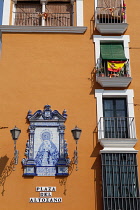 Spain, Andalucia, Seville, Ceramic tile image of the Virgin Mary at Plaza del Altozano in the Triana district.