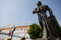 Spain, Andalucia, Seville, Statue  of the matador Curro Romero outside the Plaza de Torres.