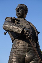 Spain, Andalucia, Seville, Statue  of the matador Curro Romero outside the Plaza de Torres.