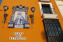 Spain, Andalucia, Seville, Ceramic tile image of the Virgin Mary at Plaza del Altozano in the Triana district.